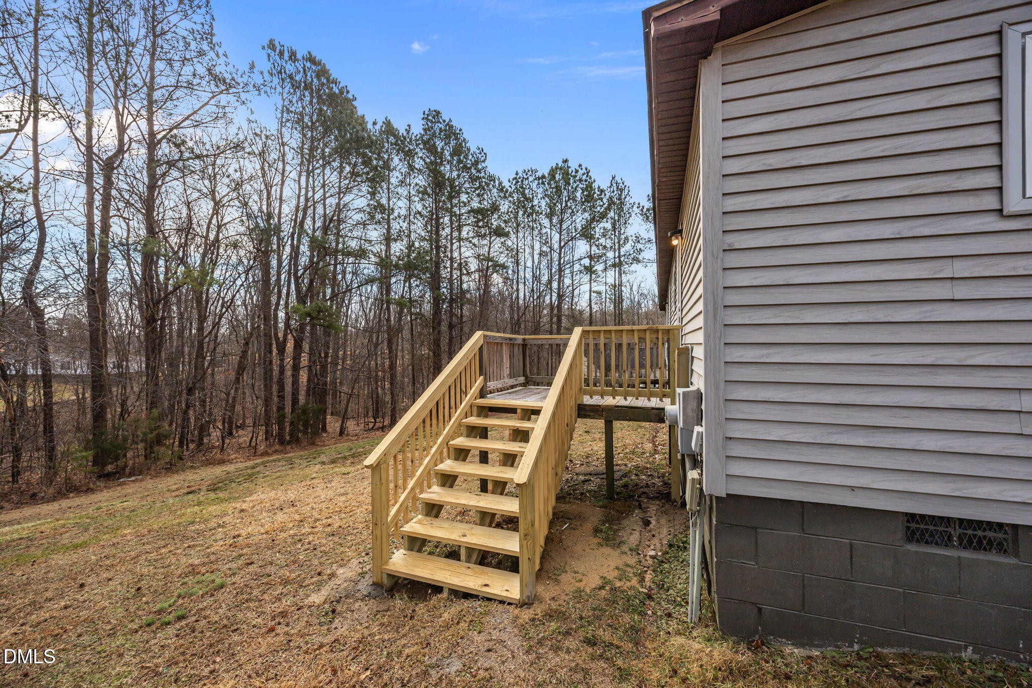 91 Pine Ridge Road Henderson, NC 27537 - Photo 39 of 50 a view of a patio with a table and chairs