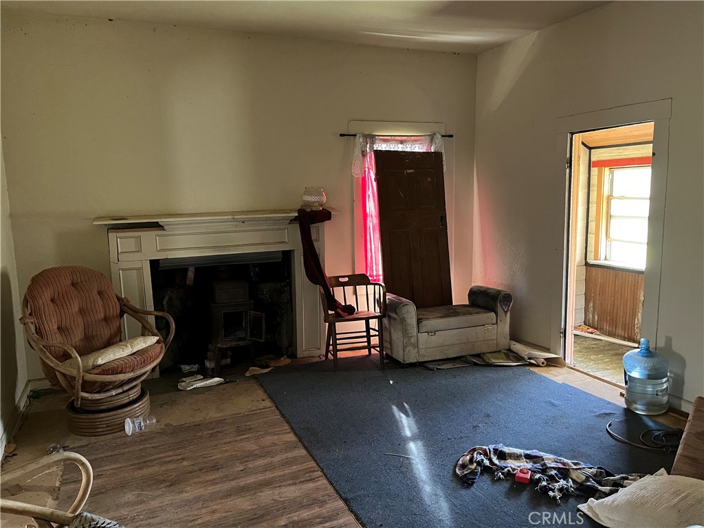 0 Tuscan Springs Road Red Bluff, CA 96080 - Photo 14 of 23 a living room with furniture and a fireplace