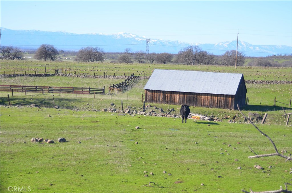 0 Tuscan Springs Road Red Bluff, CA 96080 - Photo 16 of 23 a view of a house with a yard and a large pool