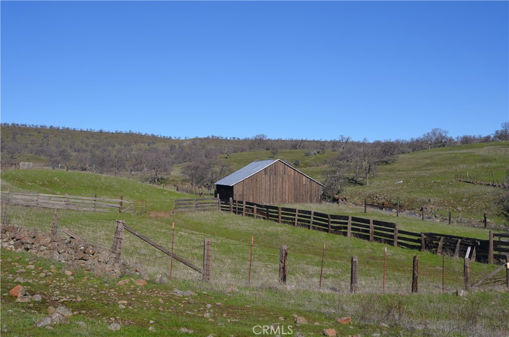 0 Tuscan Springs Road Red Bluff, CA 96080 - Photo 18 of 23 a view of a lake with a mountain in the background