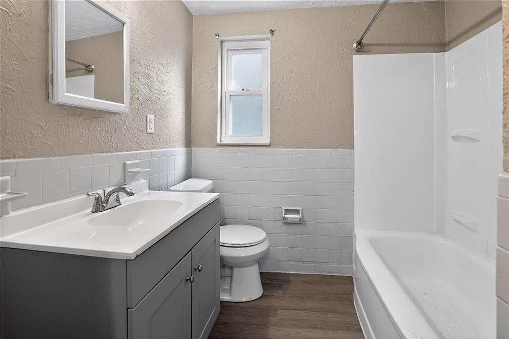 8030 Lincoln Road Verona, PA 15147 - Photo 20 of 34 a bathroom with a sink toilet and shower