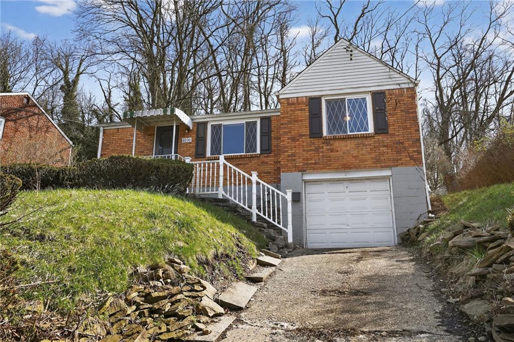 8030 Lincoln Road Verona, PA 15147 - Photo 2 of 34 a front view of a house with garden