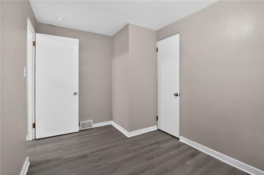 8030 Lincoln Road Verona, PA 15147 - Photo 22 of 34 a view of an empty room with wooden floor