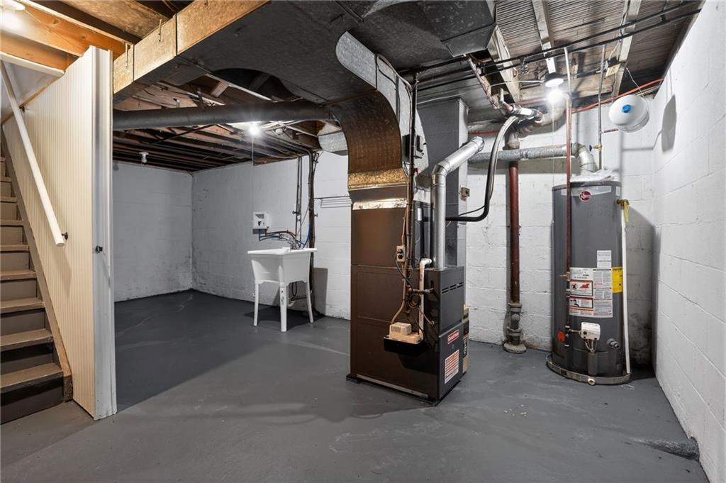 8030 Lincoln Road Verona, PA 15147 - Photo 25 of 34 a view of water heater room with stairs