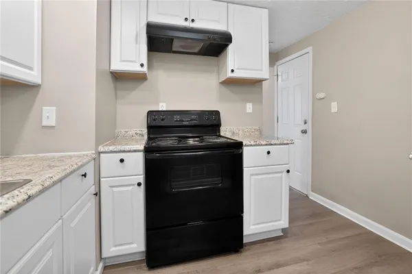 a kitchen with stainless steel appliances a stove and a refrigerator