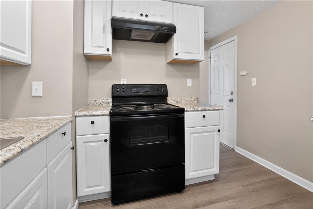 8030 Lincoln Road Verona, PA 15147 - Photo 10 of 34 a kitchen with stainless steel appliances a stove and a refrigerator