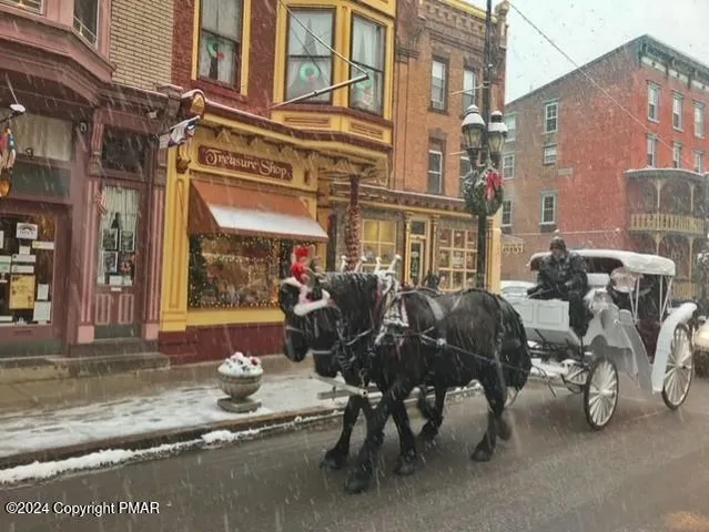 a view of a street with sitting area