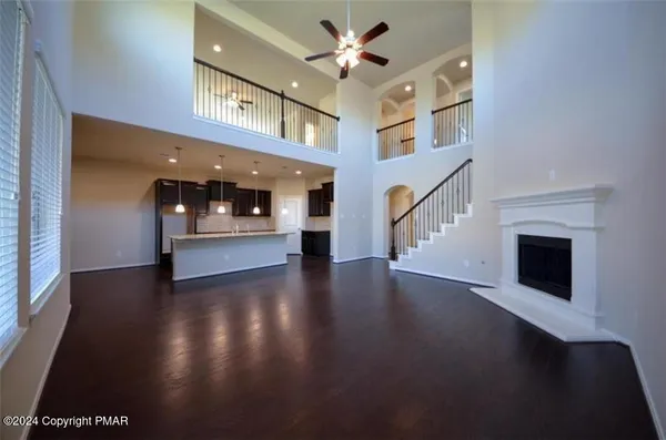 a view of an entryway with a kitchen