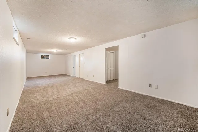 a view of a chair and tables in the garden