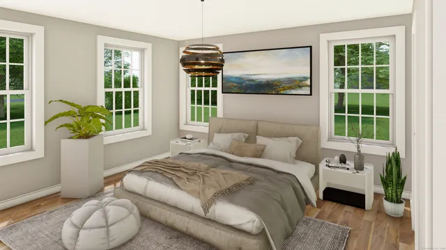 a bedroom with a bed and a large window