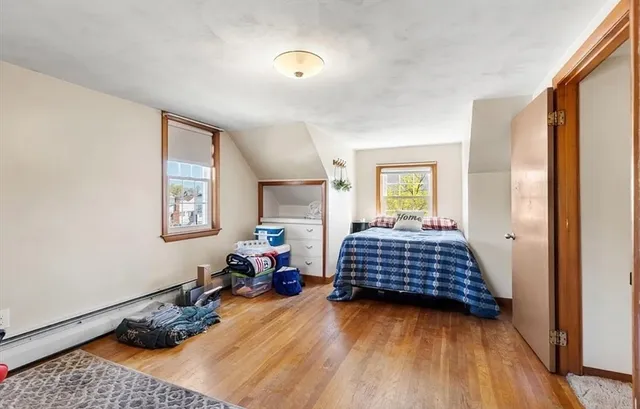 a bedroom with furniture and a window