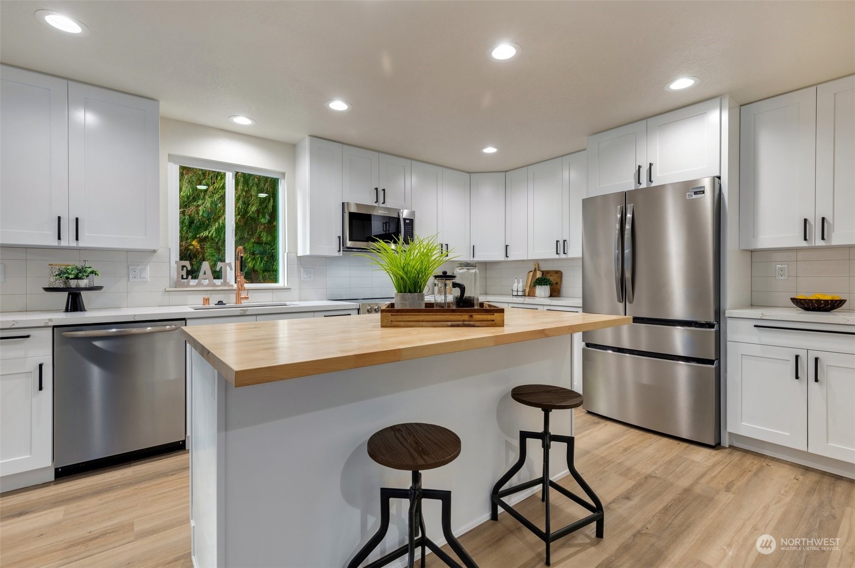 17728 28th Avenue Southeast Bothell, WA 98012 - Photo 15 of 40 a kitchen with refrigerator and microwave