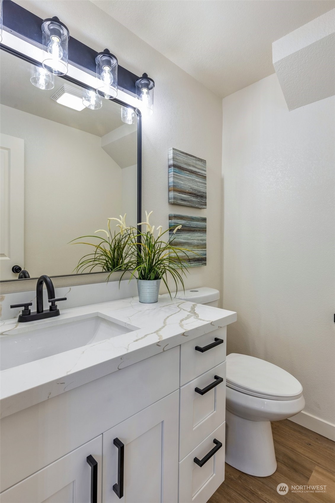 17728 28th Avenue Southeast Bothell, WA 98012 - Photo 24 of 40 a bathroom with a granite countertop sink a toilet and mirror