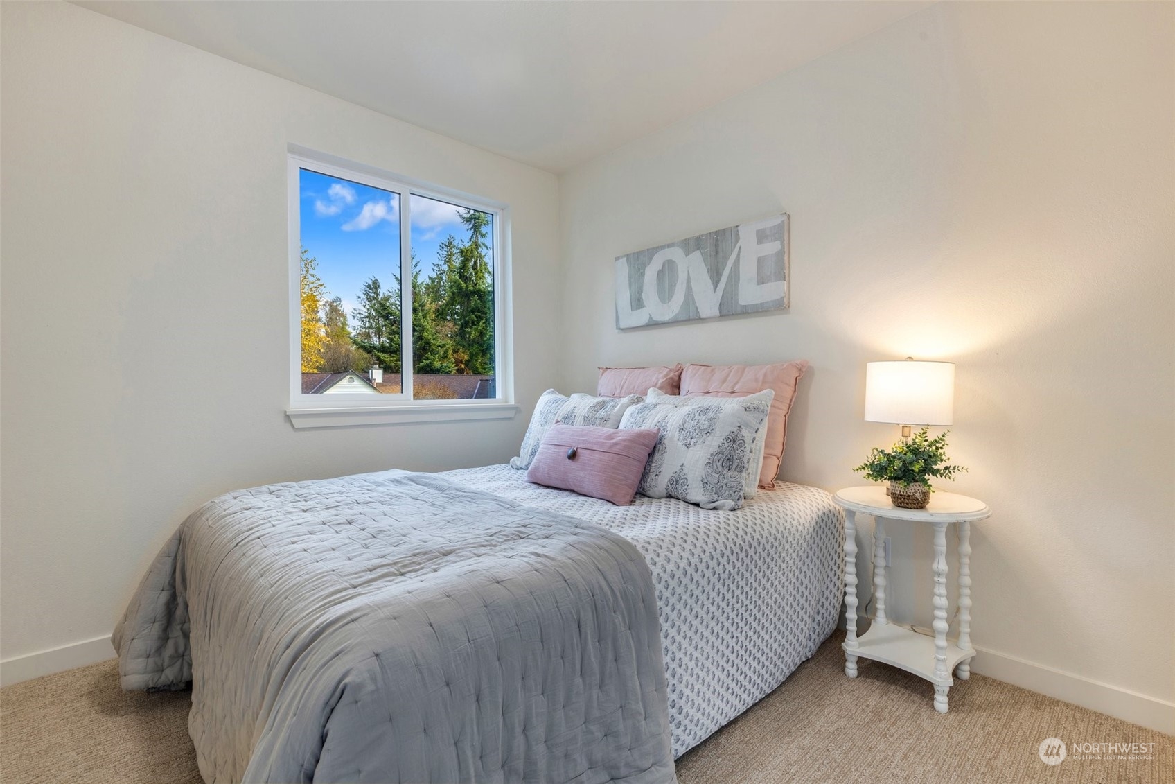 17728 28th Avenue Southeast Bothell, WA 98012 - Photo 27 of 40 a bedroom with a bed and a painting on the wall