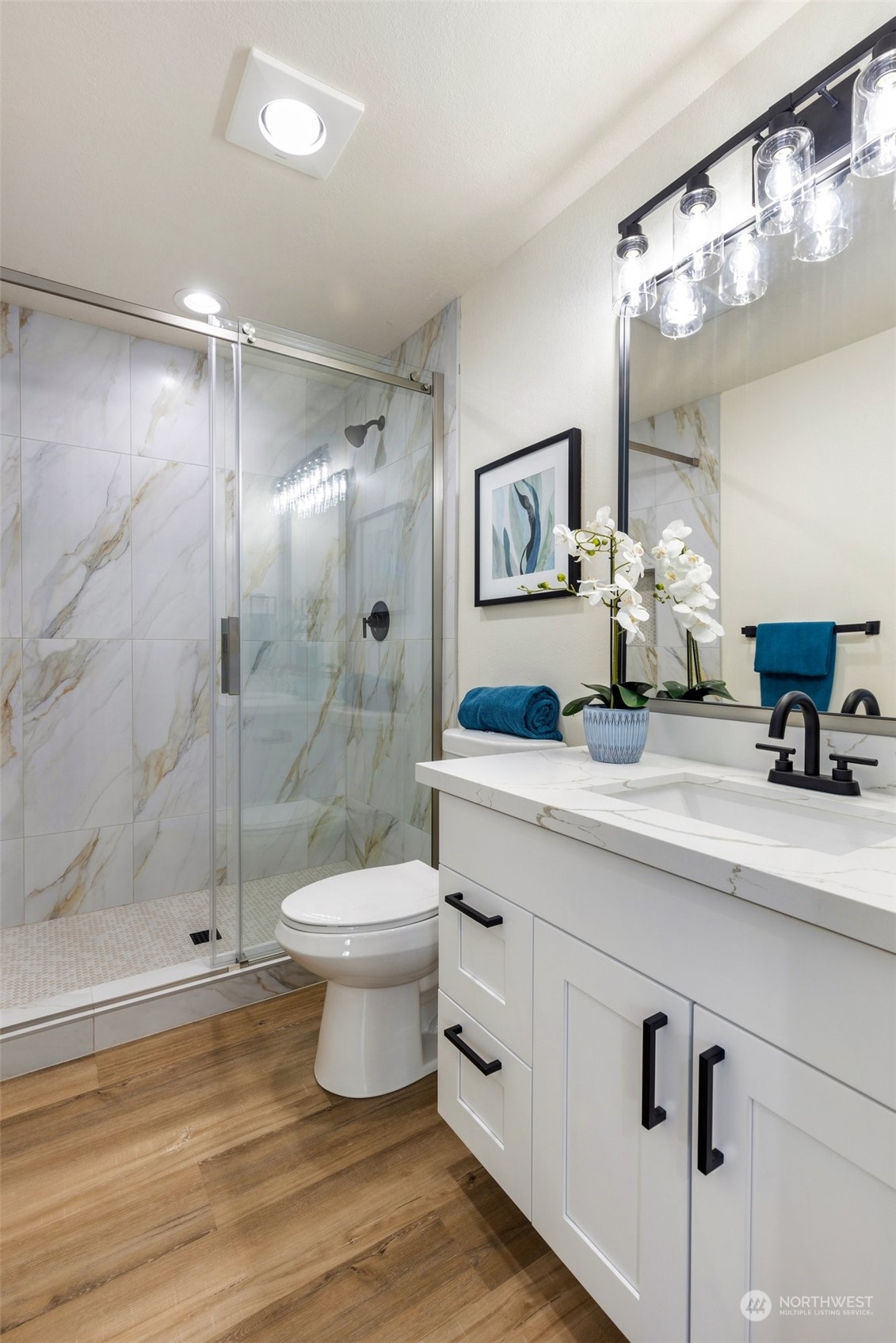 17728 28th Avenue Southeast Bothell, WA 98012 - Photo 33 of 40 a bathroom with a sink a toilet and shower