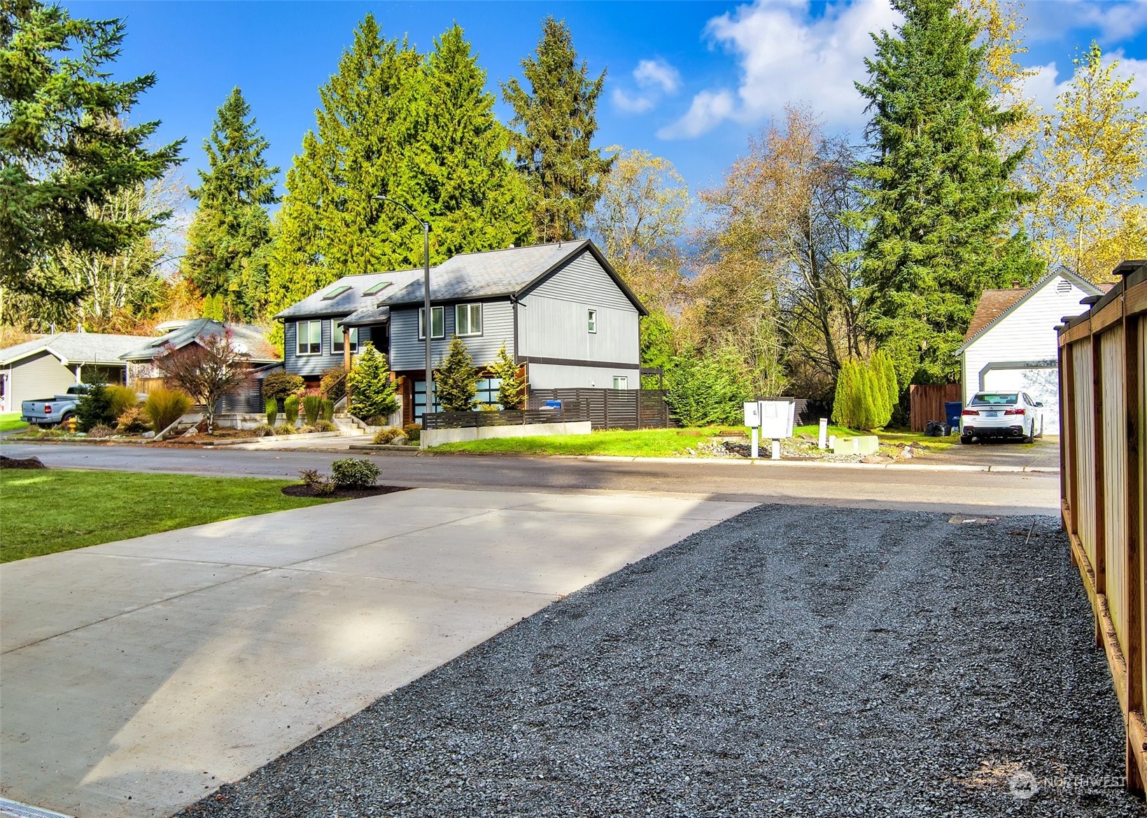 17728 28th Avenue Southeast Bothell, WA 98012 - Photo 39 of 40 a view of road with house and trees in the background