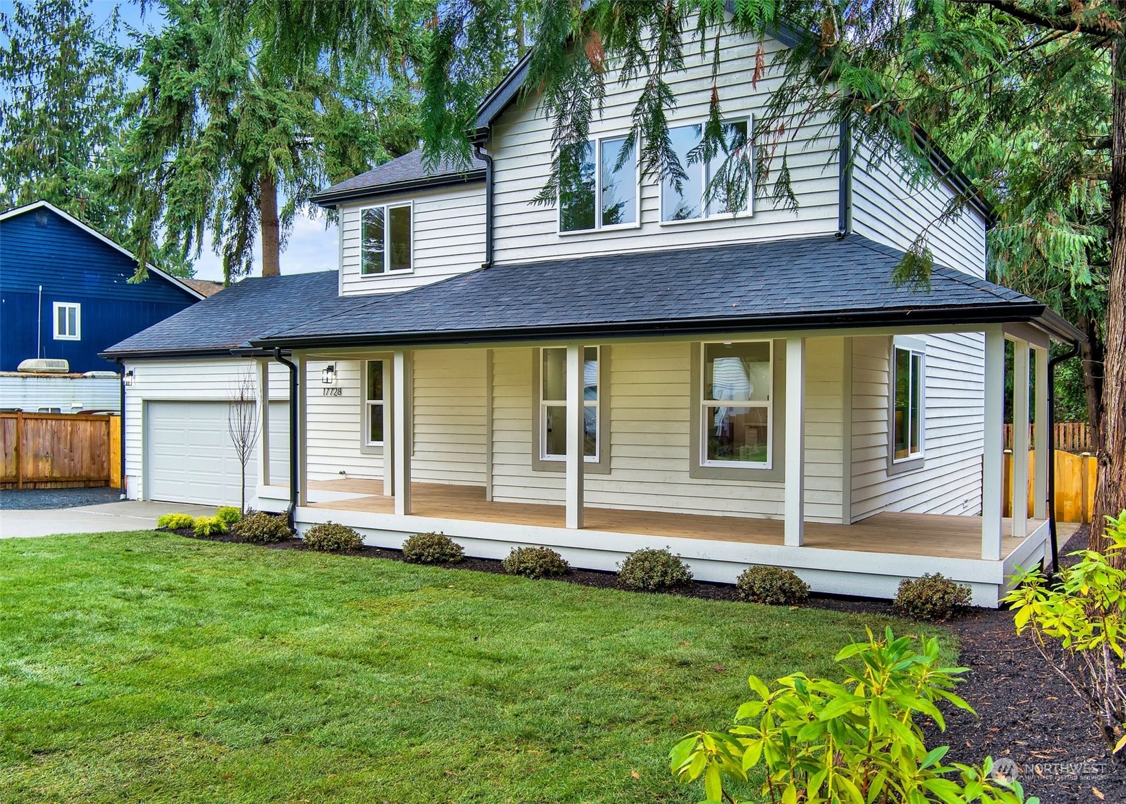 17728 28th Avenue Southeast Bothell, WA 98012 - Photo 4 of 40 a front view of a house with a yard