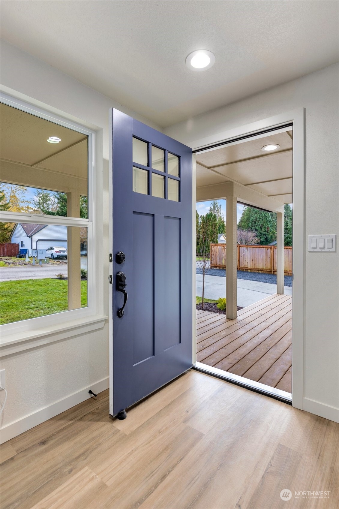 17728 28th Avenue Southeast Bothell, WA 98012 - Photo 8 of 40 an empty room with wooden floor and windows