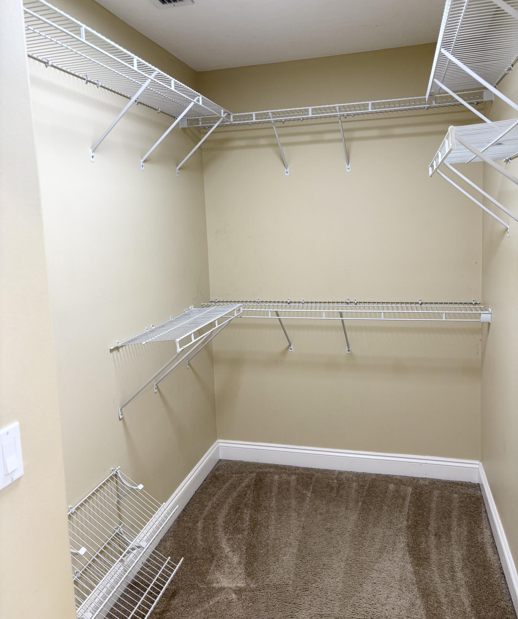 9561 Pouder Lane Navarre, FL 32566 - Photo 12 of 20 a view of a room with racks on the wall