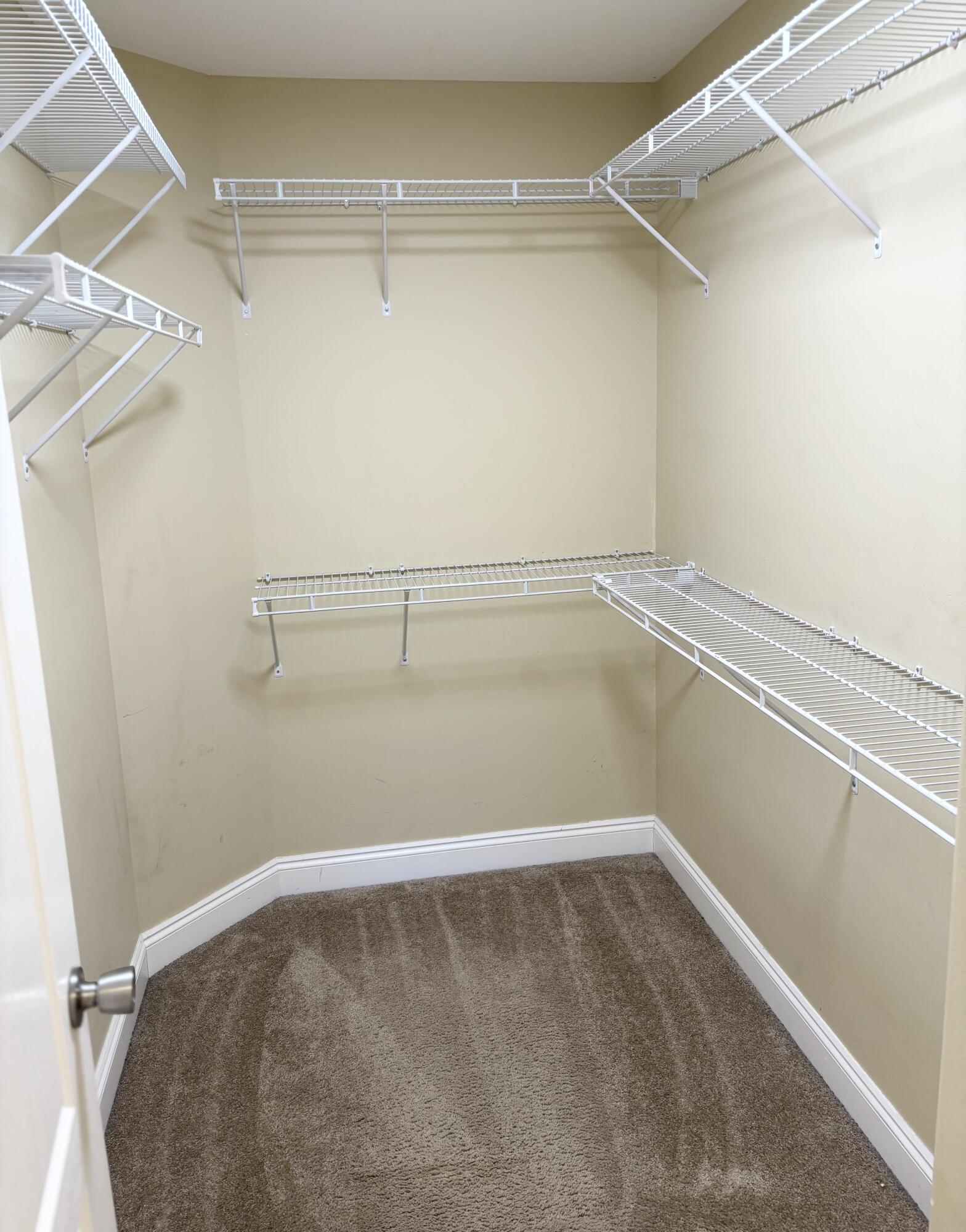 9561 Pouder Lane Navarre, FL 32566 - Photo 13 of 20 a view of a room with racks on the wall