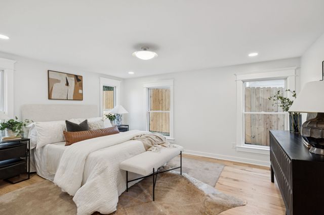 a bedroom with a bed and a couch