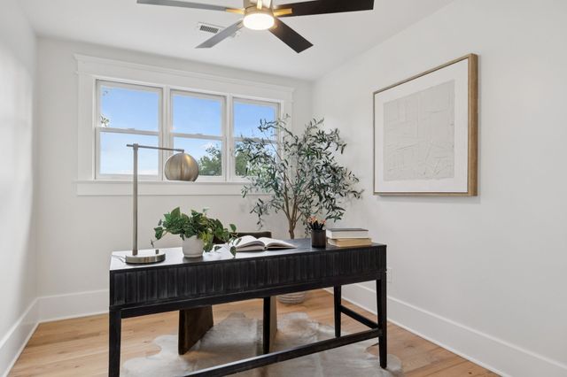 a view of a workspace with furniture