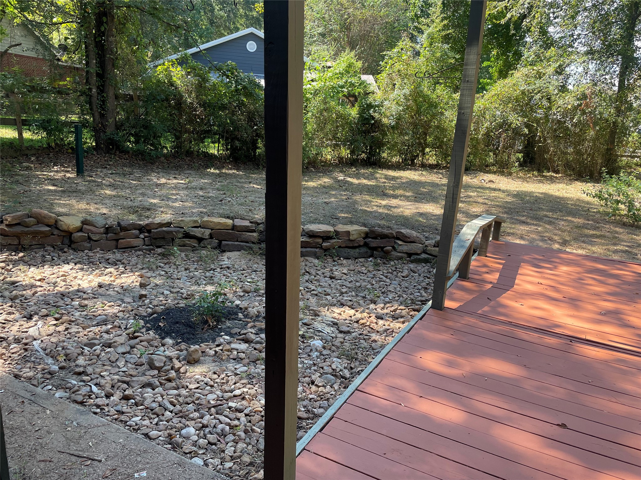 302 Somerset Conroe, TX 77316 - Photo 20 of 22 a view of a yard with wooden floor and fence