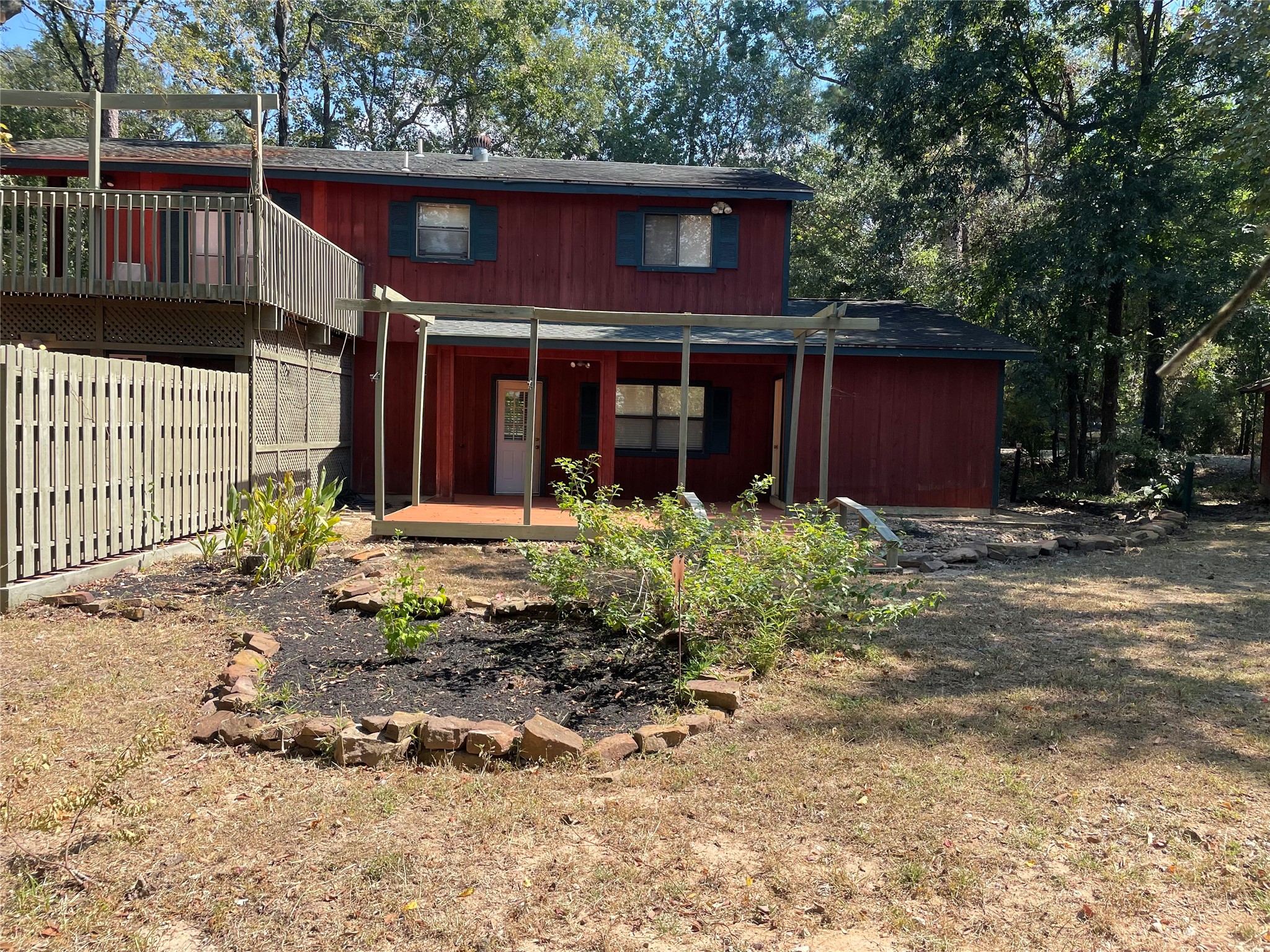 302 Somerset Conroe, TX 77316 - Photo 22 of 22 a front view of a house with garden