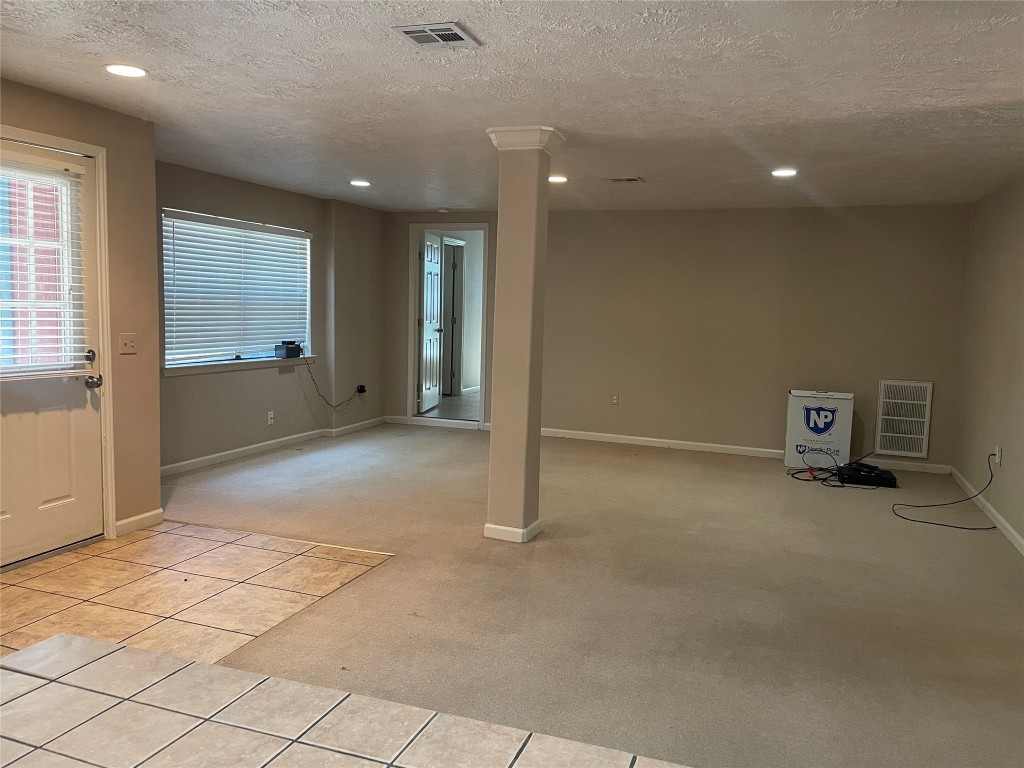 302 Somerset Conroe, TX 77316 - Photo 8 of 22 a view of an empty room with a window