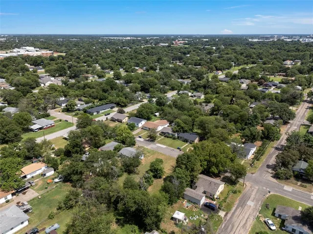 an aerial view of a city with lots of residential buildings
