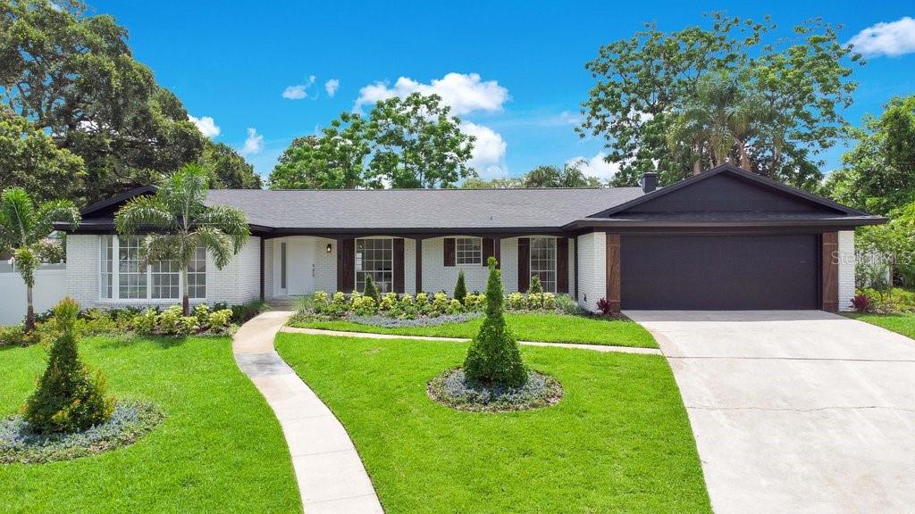 100 Spring Cove Trail Altamonte Springs, FL 32714 - Photo 1 of 1 a front view of a house with a yard