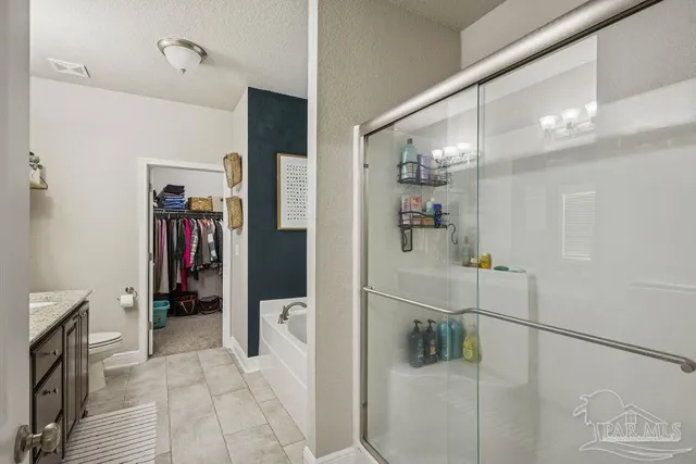 a hallway with a white stove top oven and a refrigerator