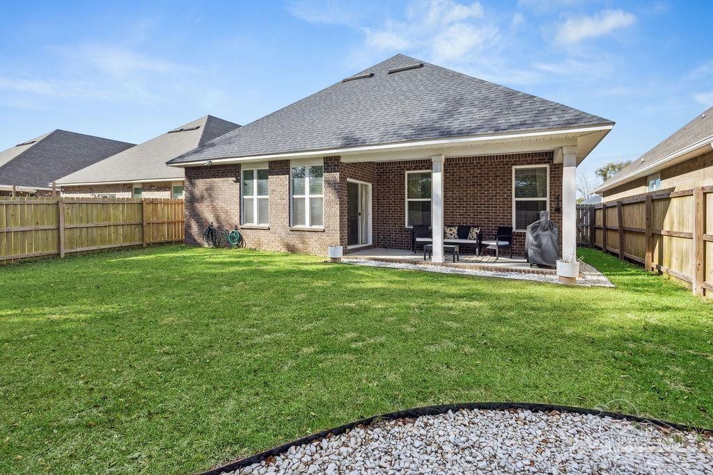 5392 Parkside Drive Pace, FL 32571 - Photo 25 of 28 a view of a house with a yard and porch
