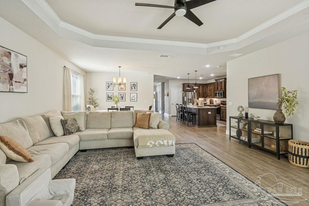 5392 Parkside Drive Pace, FL 32571 - Photo 4 of 28 a living room with furniture and wooden floor