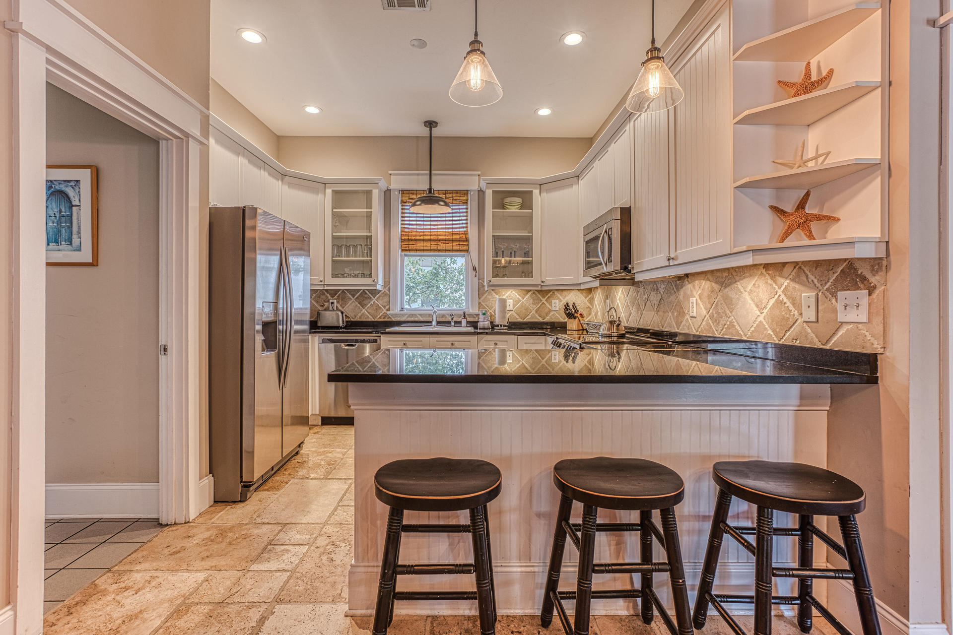55 Beach Bike Way Seacrest, FL 32461 - Photo 1 of 43 a kitchen with granite countertop a table and chairs in it