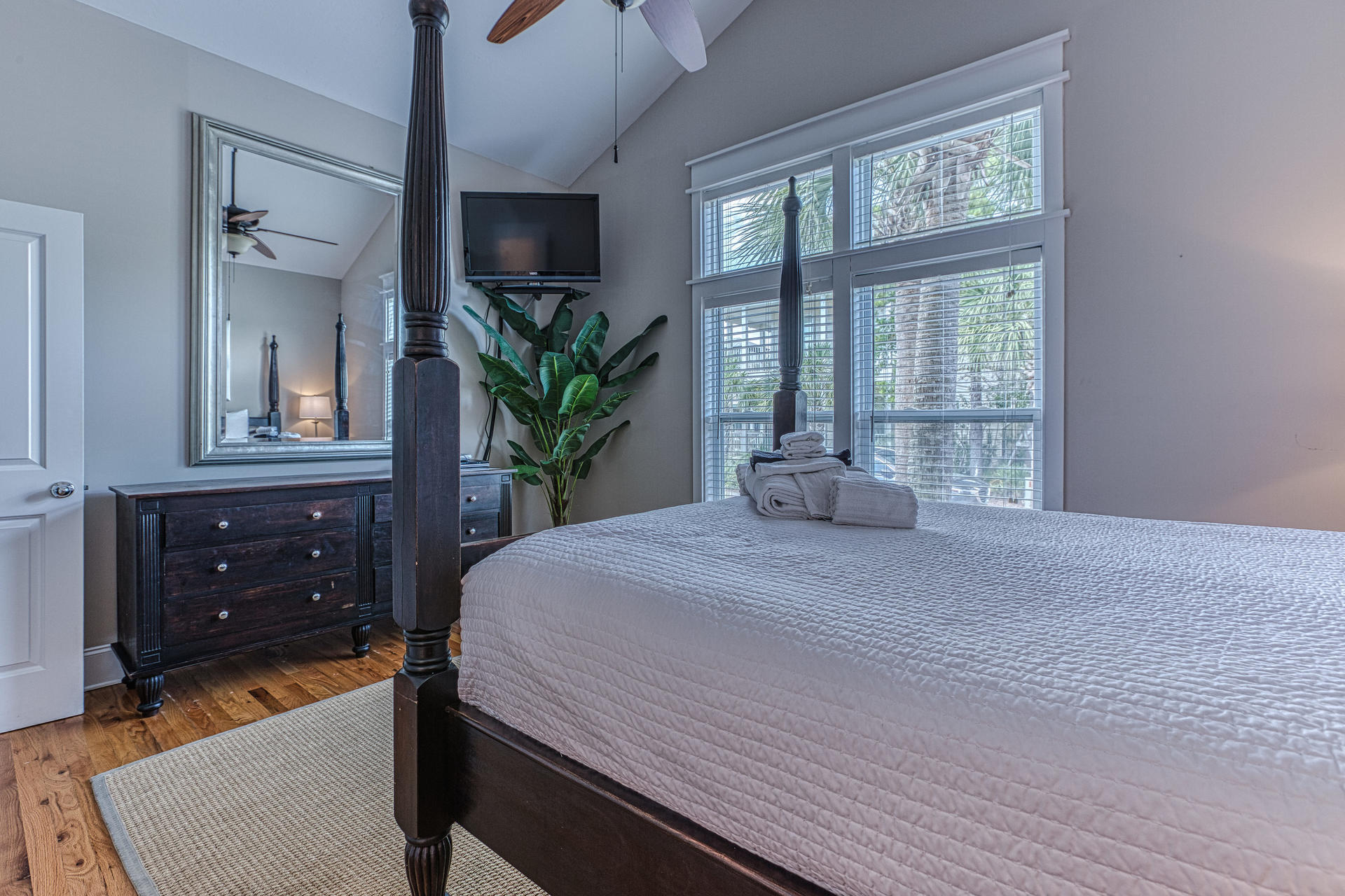 55 Beach Bike Way Seacrest, FL 32461 - Photo 15 of 43 a bedroom with a bed and a potted plant