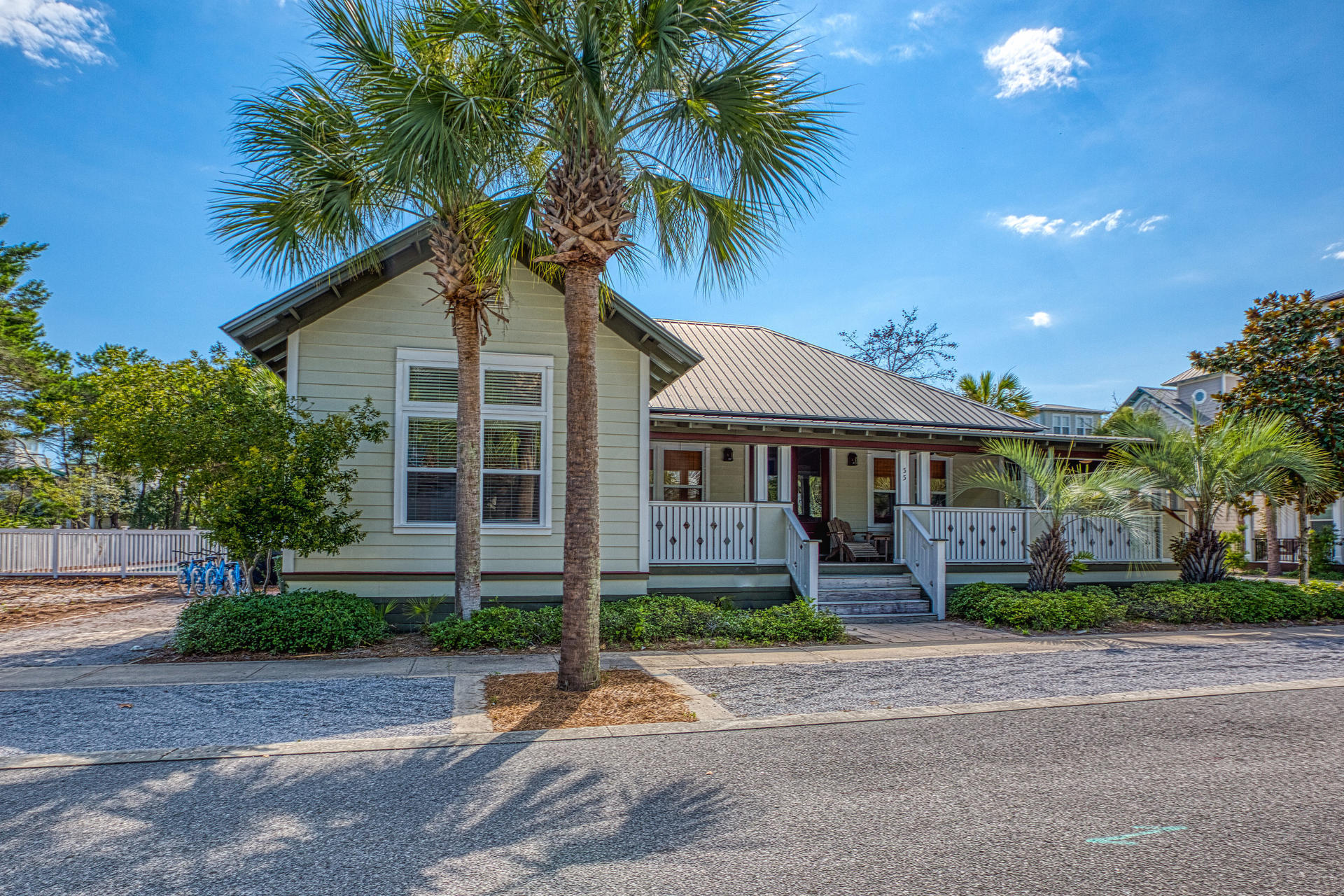 55 Beach Bike Way Seacrest, FL 32461 - Photo 27 of 43 a front view of a house with a garden and a garage