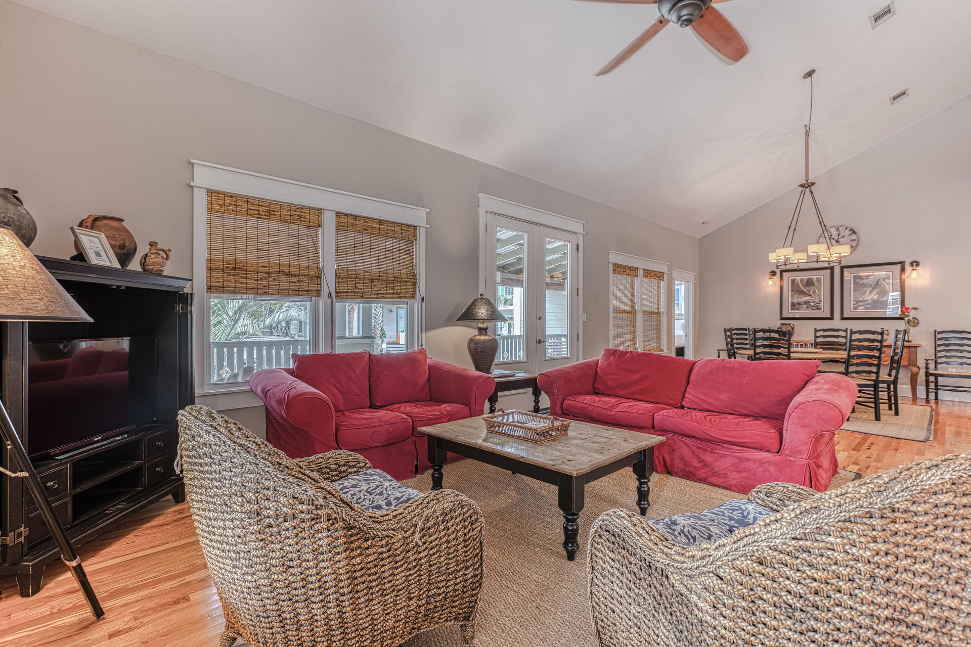 55 Beach Bike Way Seacrest, FL 32461 - Photo 7 of 43 a living room with furniture a flat screen tv and a fireplace