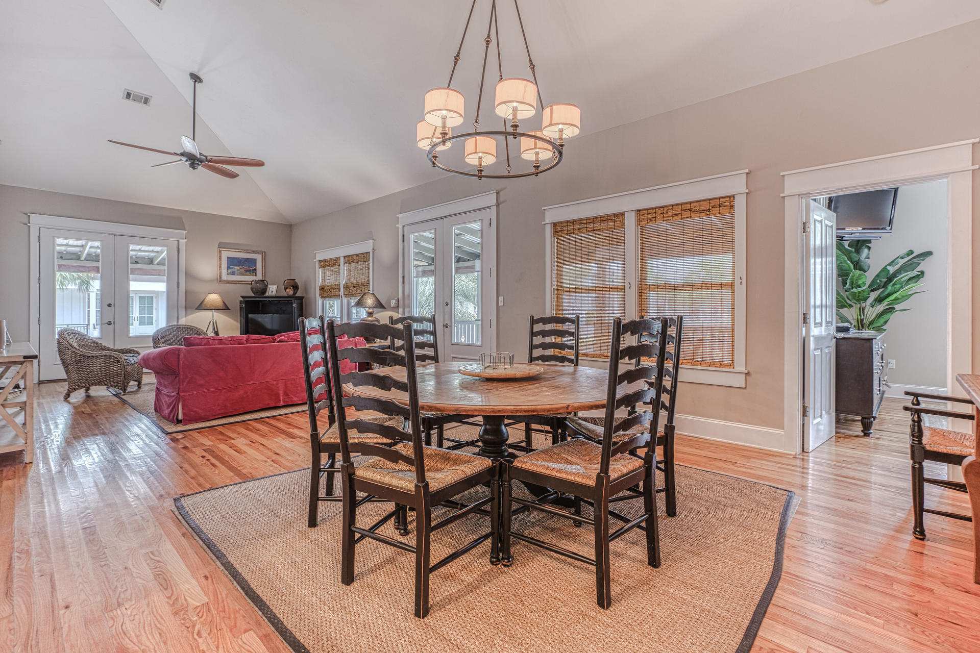 55 Beach Bike Way Seacrest, FL 32461 - Photo 9 of 43 a view of a dining room with furniture wooden floor and chandelier