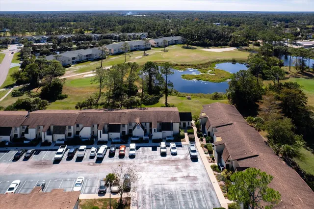 an aerial view of residential houses and outdoor space