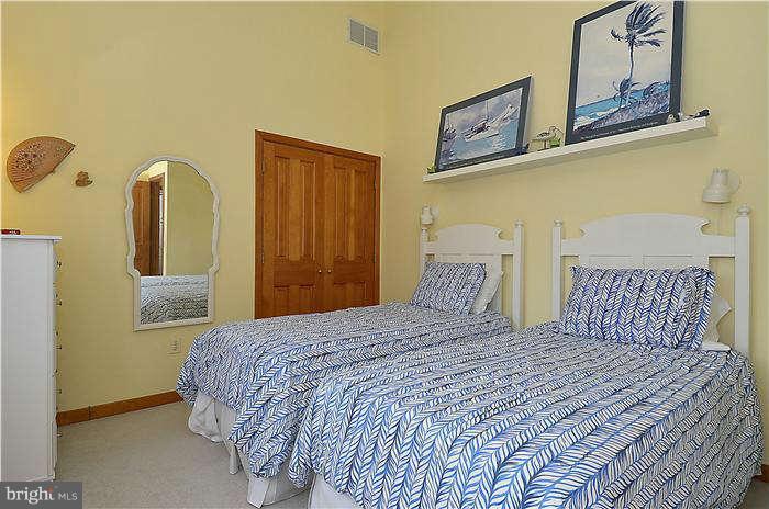 1201 Rogers Road Edgewater, MD 21037 - Photo 22 of 30 a bedroom with a bed and wooden floor