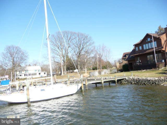 1201 Rogers Road Edgewater, MD 21037 - Photo 4 of 30 a view of a lake with chairs