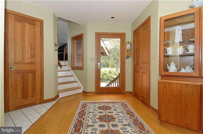 1201 Rogers Road Edgewater, MD 21037 - Photo 8 of 30 a view of a hallway with wooden floor and windows