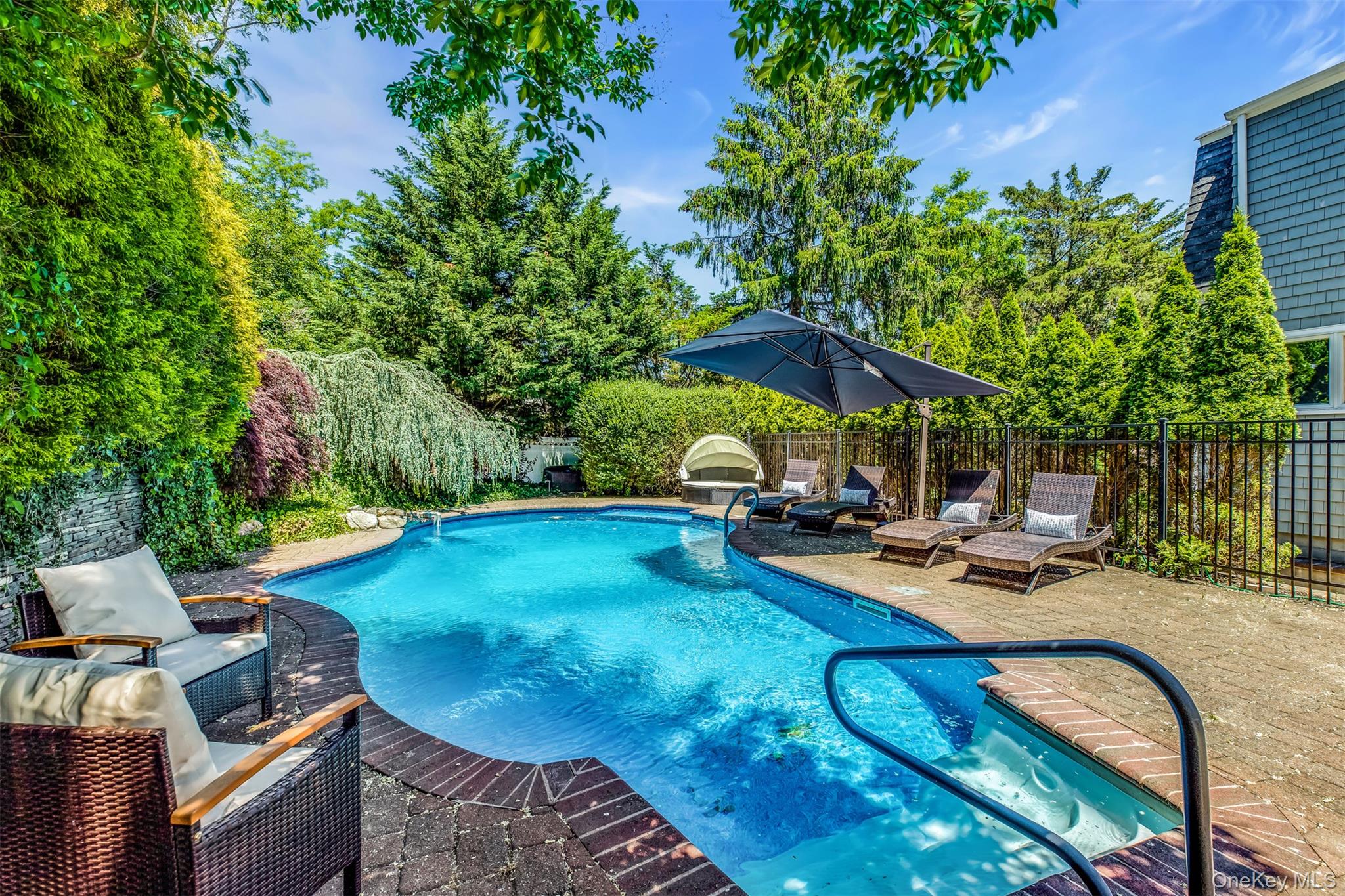 345 Colonial Road Southold, NY 11971 - Photo 2 of 43 a view of a backyard with sitting area and furniture