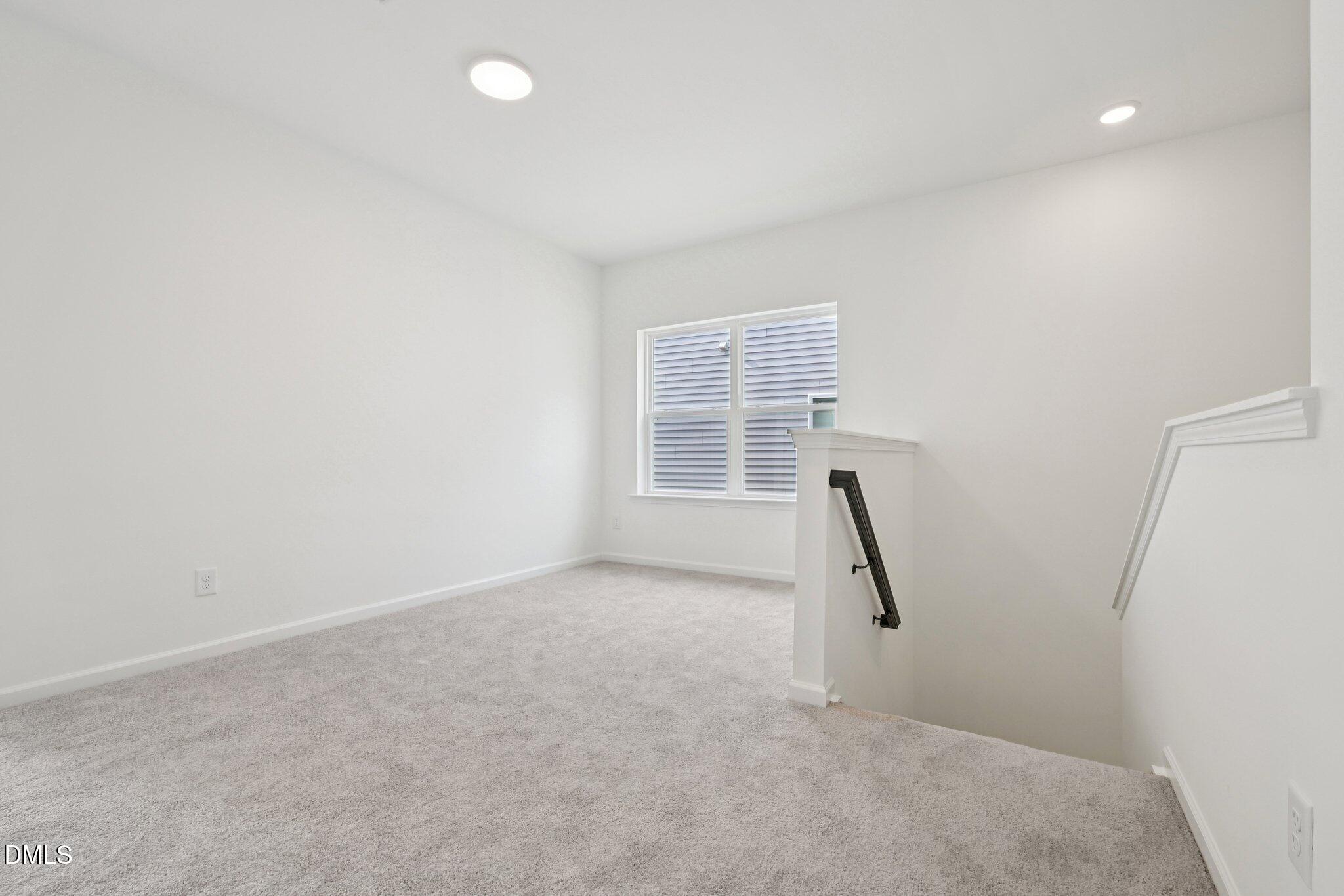 916 Fetching Place, Unit 344 Rolesville, NC 27571 - Photo 19 of 37 an empty room with a window