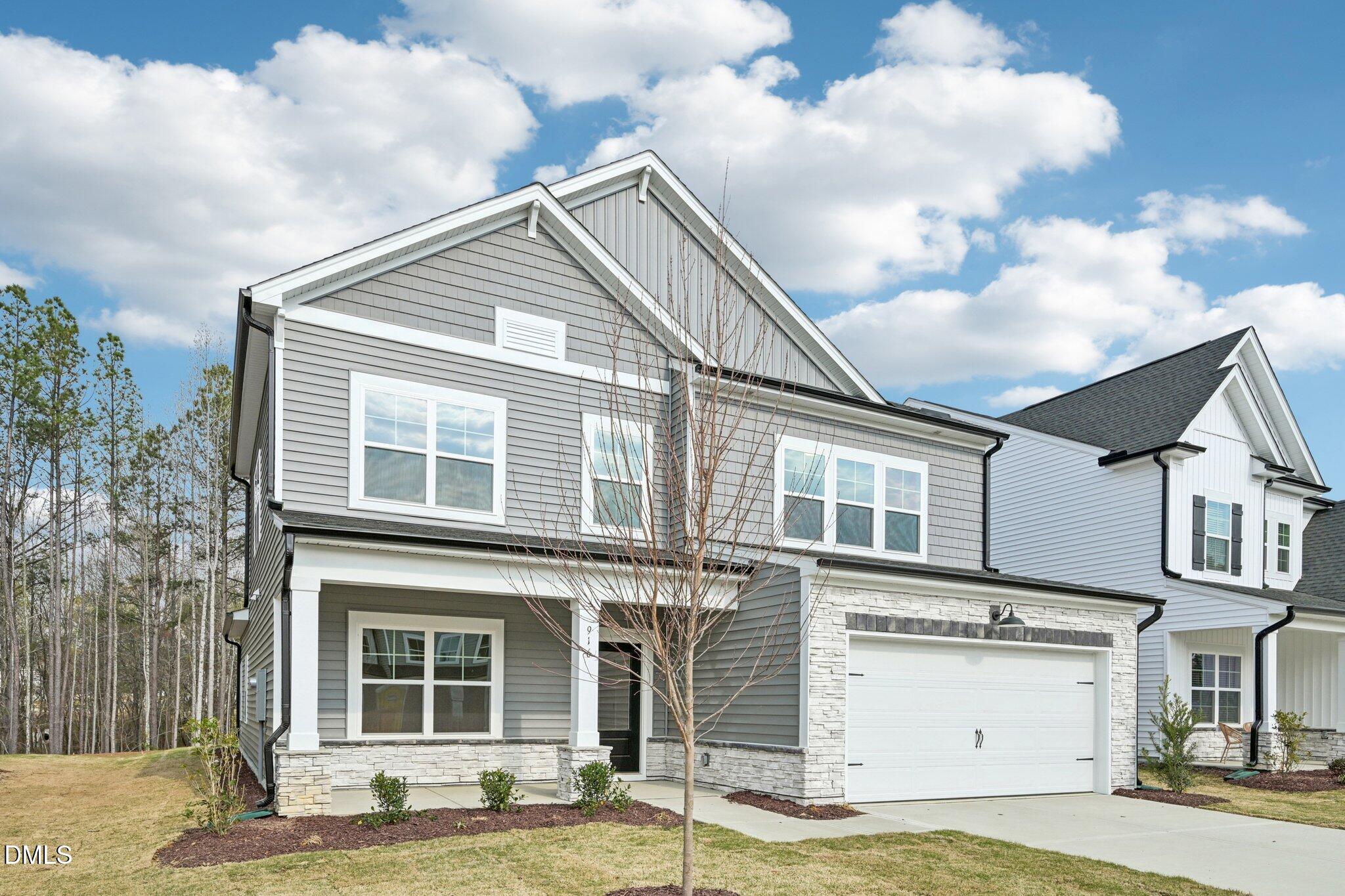 916 Fetching Place, Unit 344 Rolesville, NC 27571 - Photo 2 of 37 a view of a white building among the street