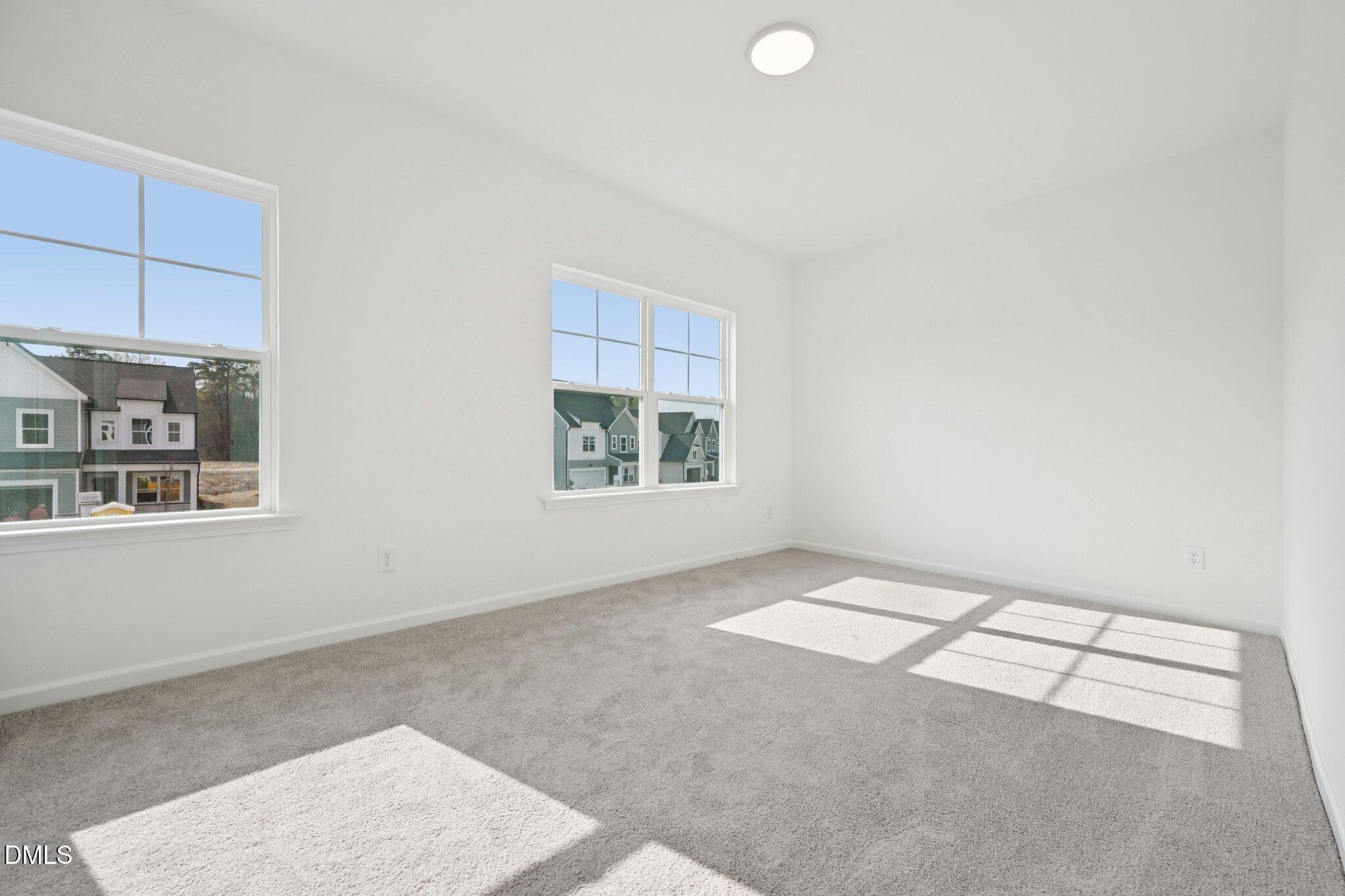 916 Fetching Place, Unit 344 Rolesville, NC 27571 - Photo 21 of 37 an empty room with windows