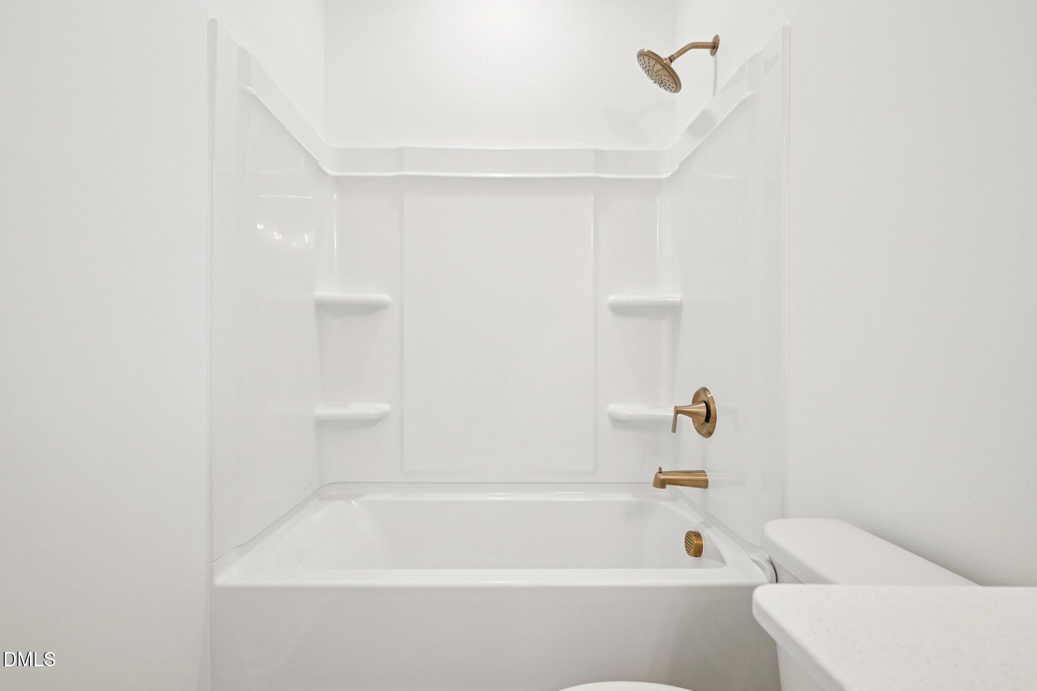 916 Fetching Place, Unit 344 Rolesville, NC 27571 - Photo 24 of 37 a bathroom with a bathtub and shower