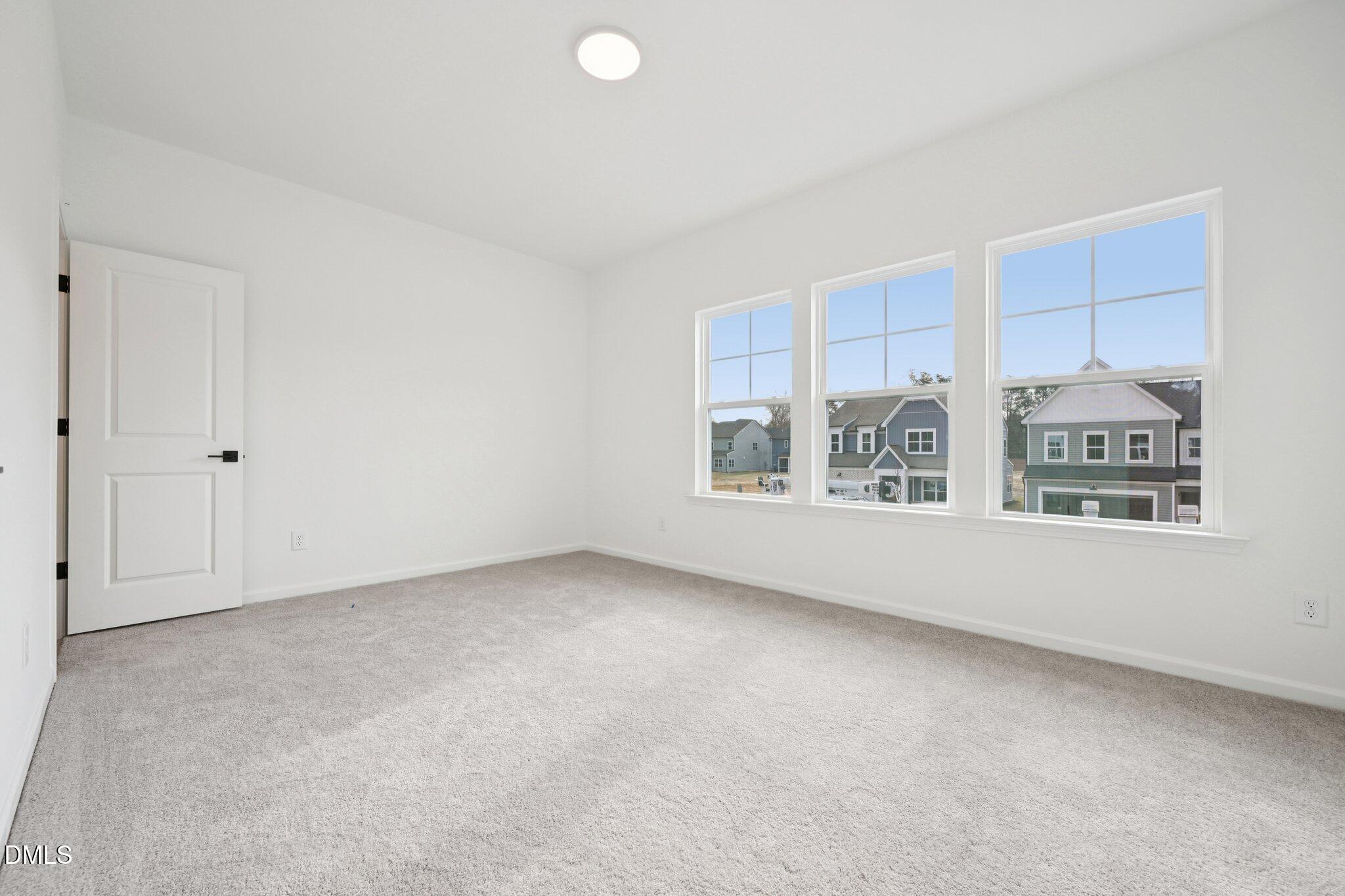 916 Fetching Place, Unit 344 Rolesville, NC 27571 - Photo 25 of 37 a view of an empty room with a window