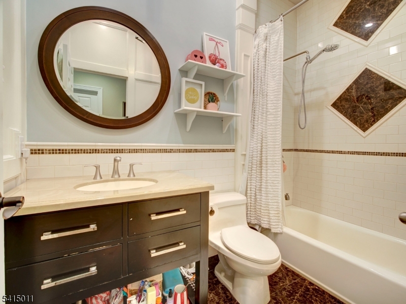 23 Ryerson Road Flemington, NJ 08822 - Photo 26 of 44 a bathroom with a toilet a sink and a mirror